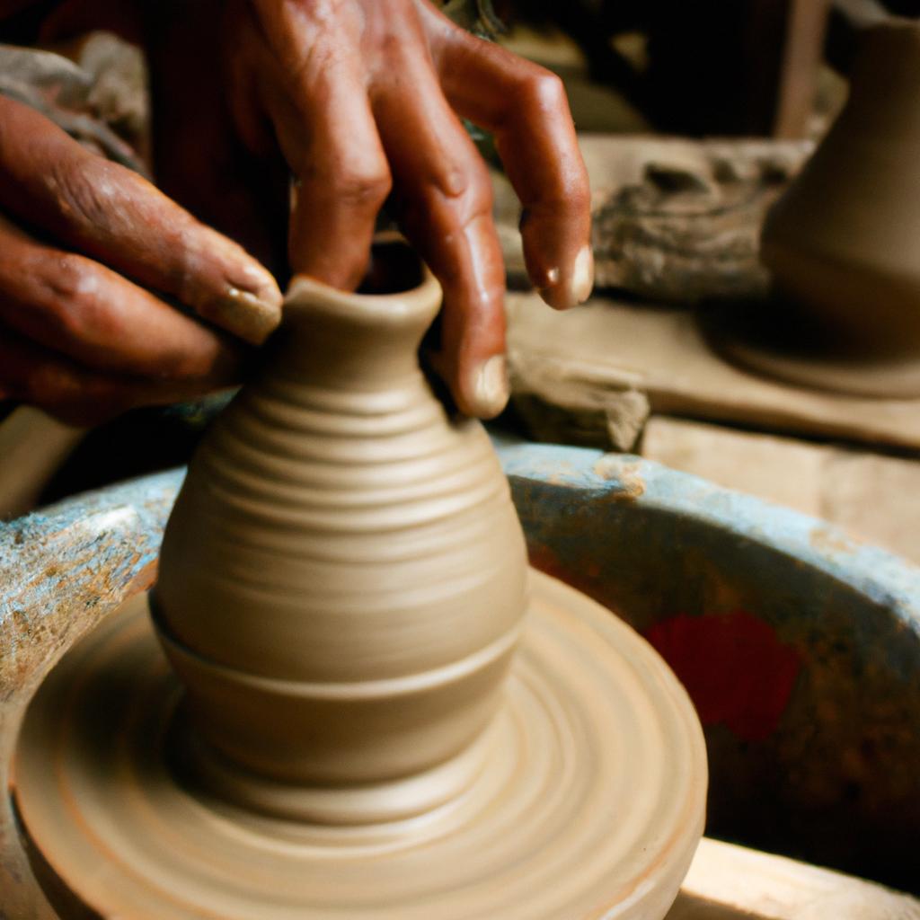 Artisan crafting traditional pottery