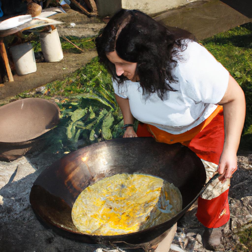 Woman cooking traditional dish outdoors